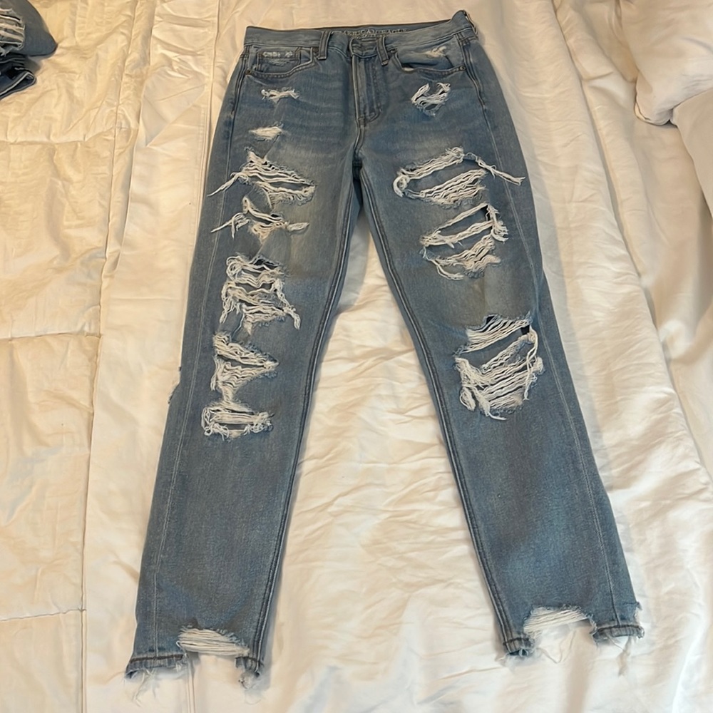 American Eagle. Size 2. boyfriend Jeans. light wash. Many rips up front and back